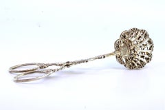 Silver salad or bread tongs with cutout shells and raised stems
