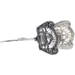 Silver salad or bread tongs with cutout shells and raised stems