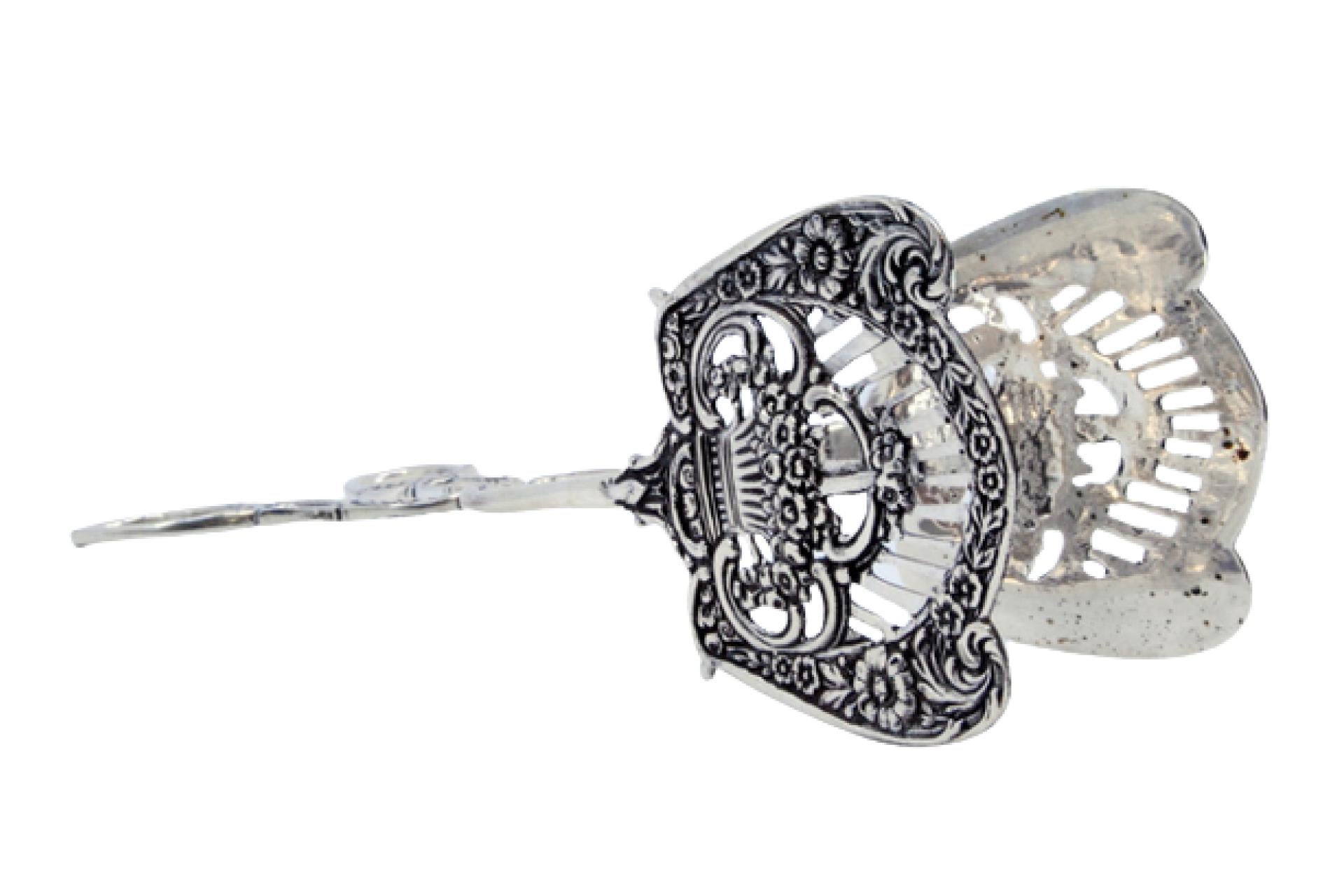 Silver salad or bread tongs with cutout shells and raised stems For Sale