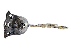 Silver salad or bread tongs with cutouts and intertwined stems