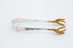 Silver salad tongs with gold claws