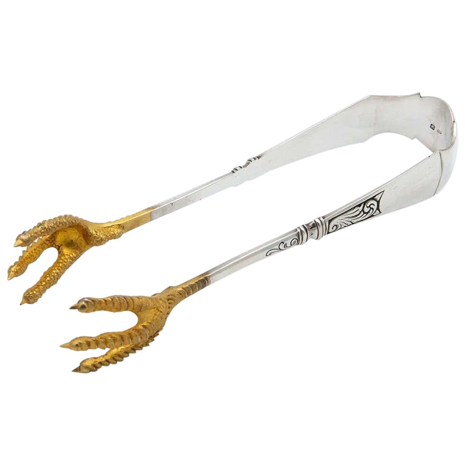 Silberne Salatzange mit goldenen Krallen im Angebot