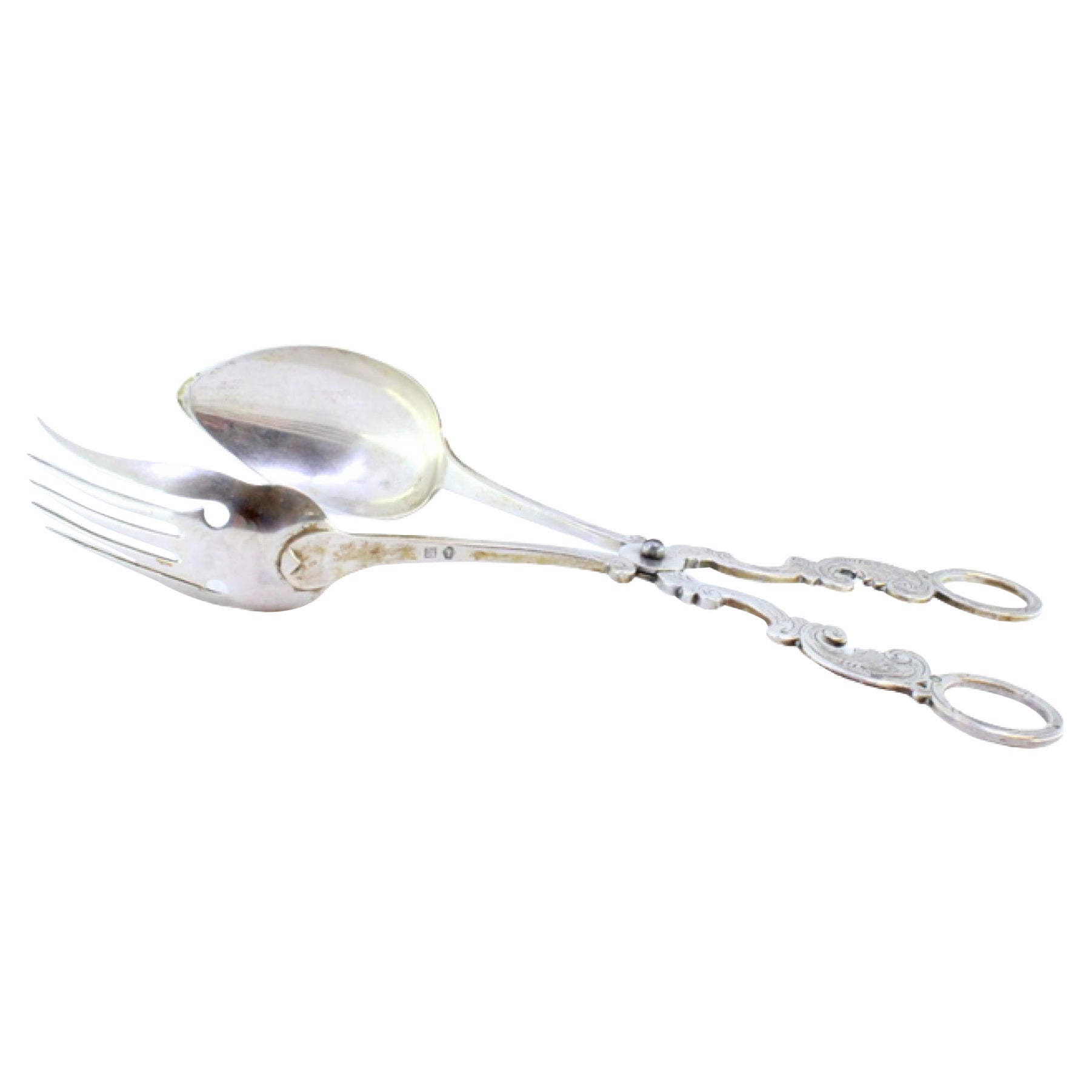 Silver salad tongs with spoon and fork embossed on the handles