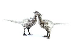 Silver salt and pepper shaker set in the shape of pheasants with reliefs