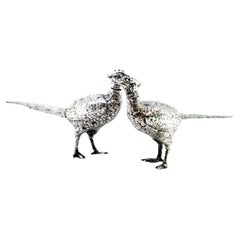 Silver salt and pepper shaker set in the shape of pheasants with reliefs Vintage Silver salt and pepper shaker set in the shape of pheasants with reliefs