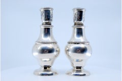 Silver salt and pepper shakers with pearls on the body and screw caps