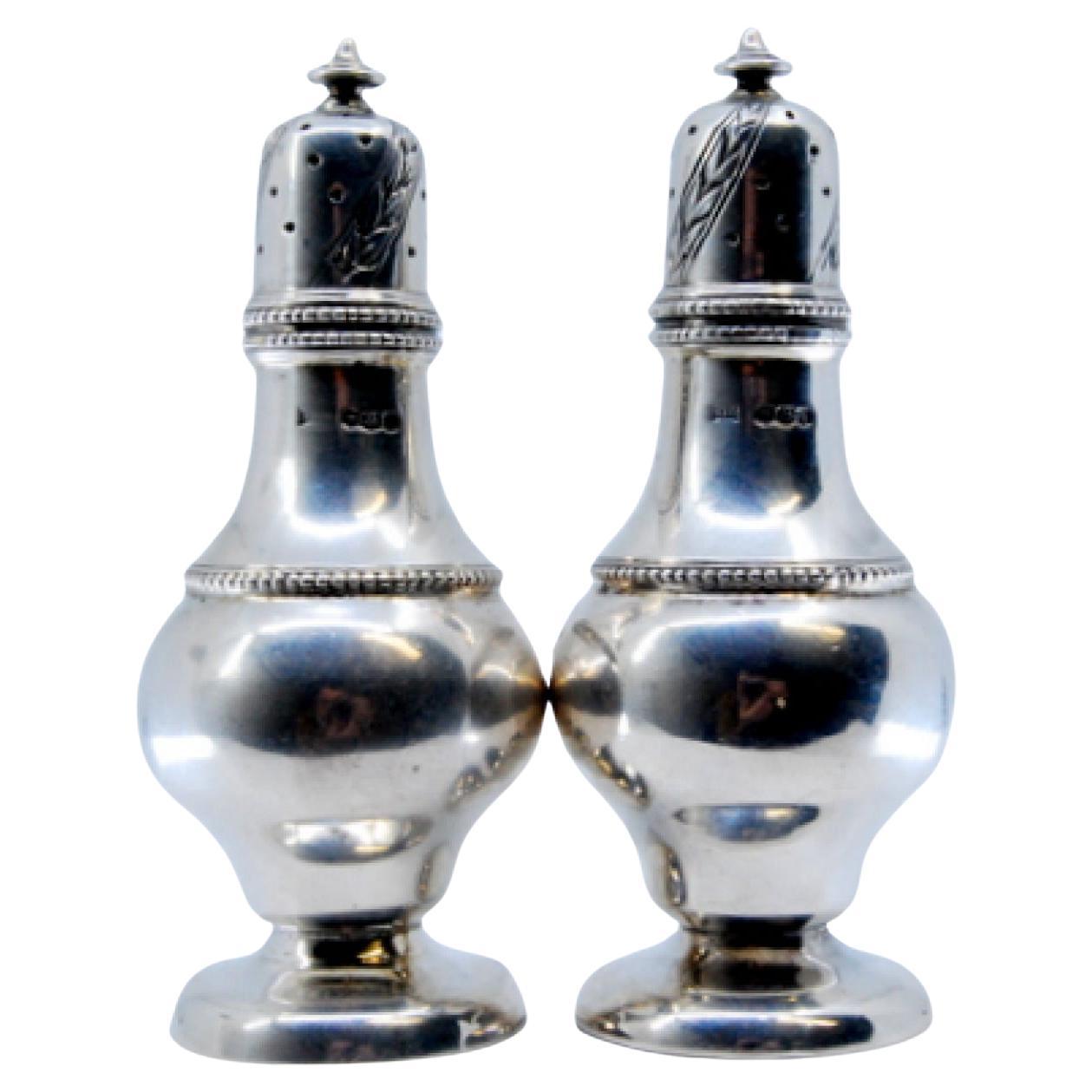 Silver salt and pepper shakers with pearls on the body and screw caps