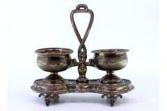 Silver salt & pepper shakers with pearly friezes on four embossed feet