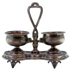 Silver salt 
pepper shakers with pearly friezes on four embossed feet