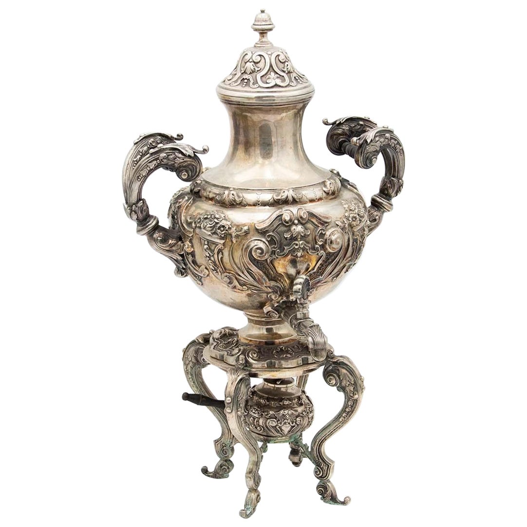 Silver samovar with engraving and four support legs