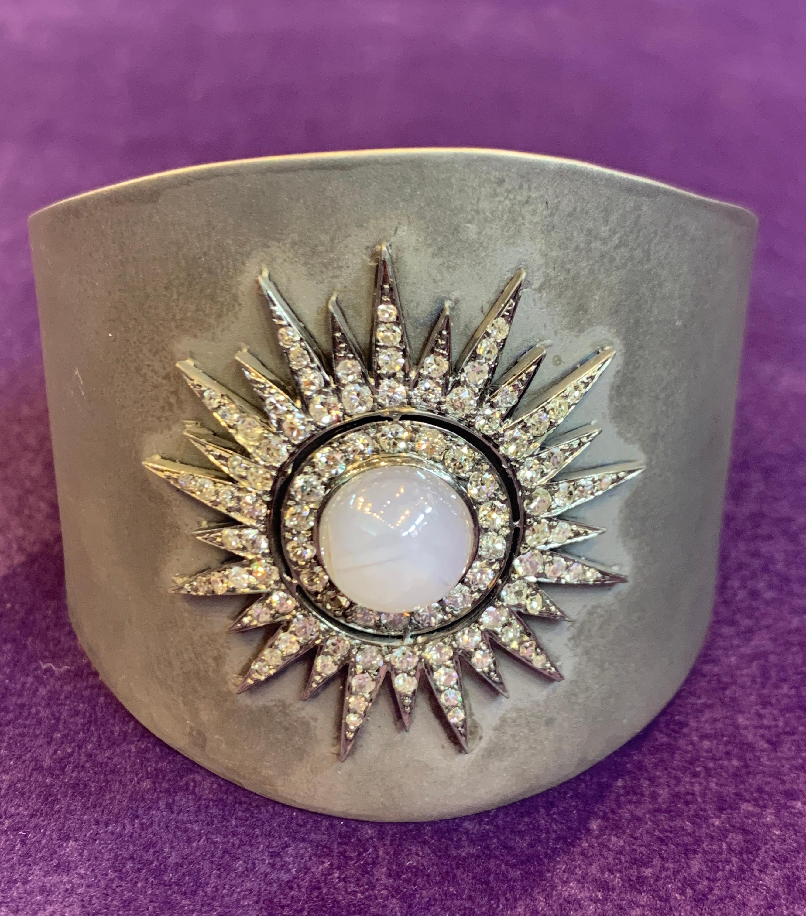 Silver & Gold Light Blue Cabochon Star Sapphire Bangle with 2.00 cts of diamonds and cabochon Victorian star brooch soldered on a modern gold & silver cuff
89.1 Grams
6.25 inches in diameter
2 inches wide 
