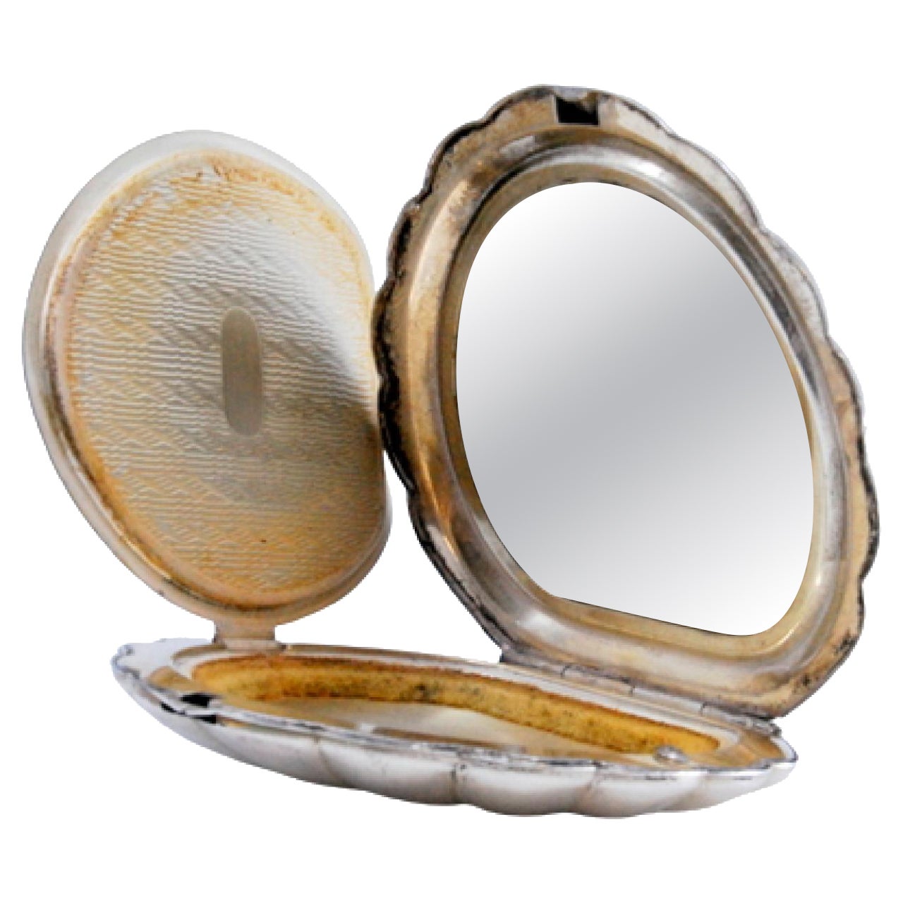 Silver scallop-shaped toiletry box with mirror inside