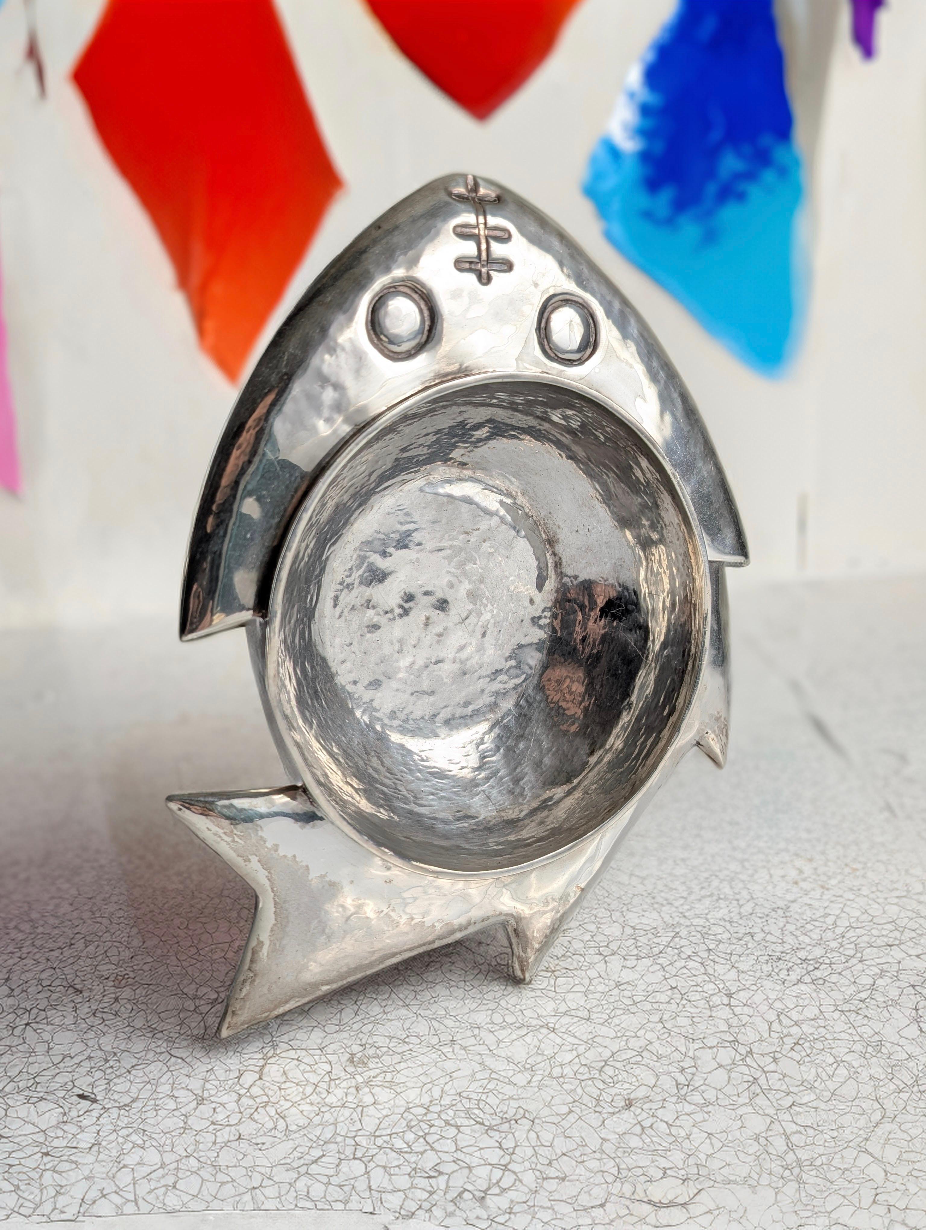This stunning sculptural sterling silver fish-shaped bowl was designed by the renowned artist Graziella Laffi in Lima, Peru, circa 1965. The piece, marked on the rim with 
