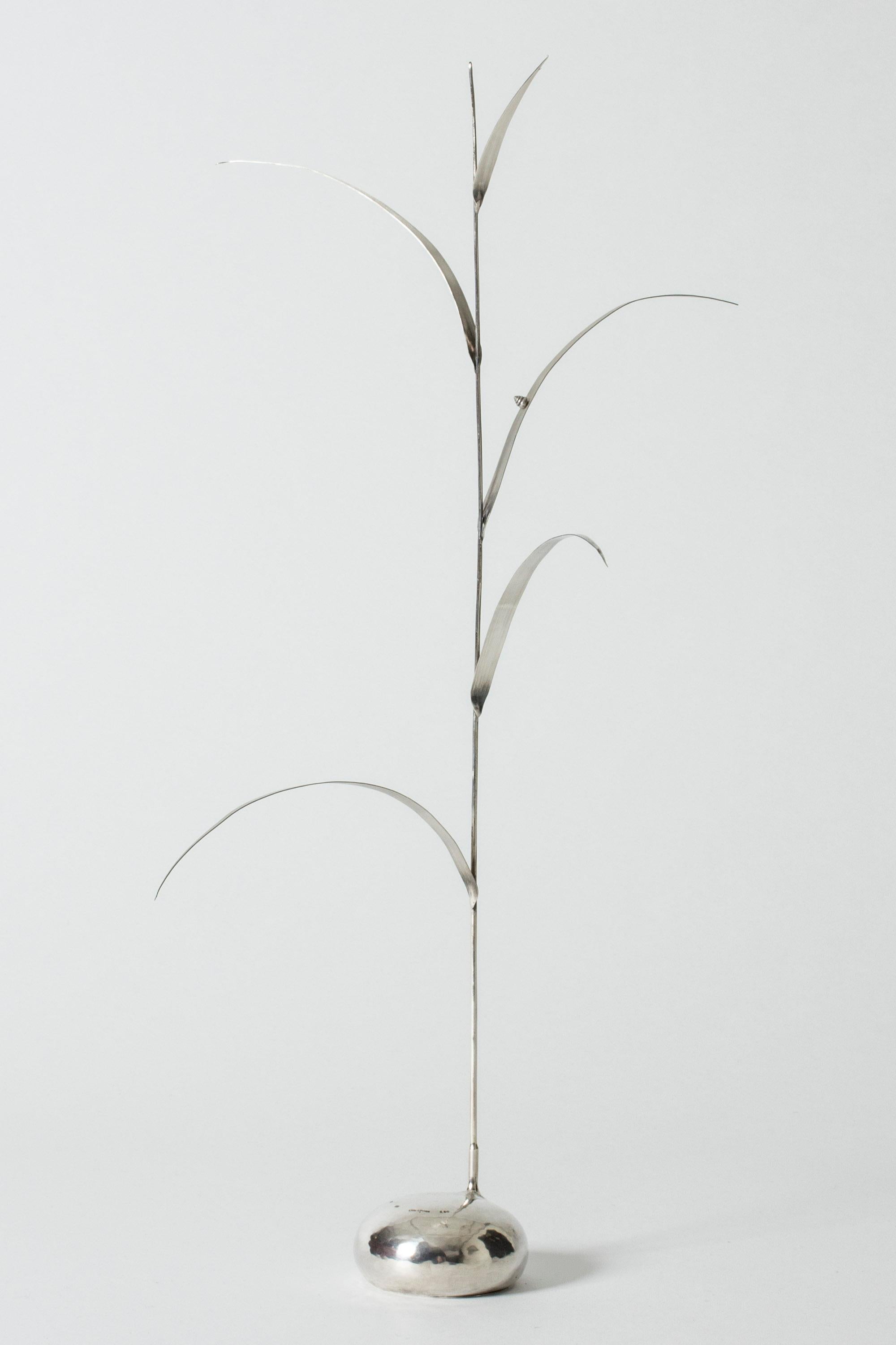 Amazing silver sculpture by Olle Ohlsson, made in the form of a reed with a slender stem and delicately sculpted leaves. The tiny shell of a snail sits on one of the long leaves.