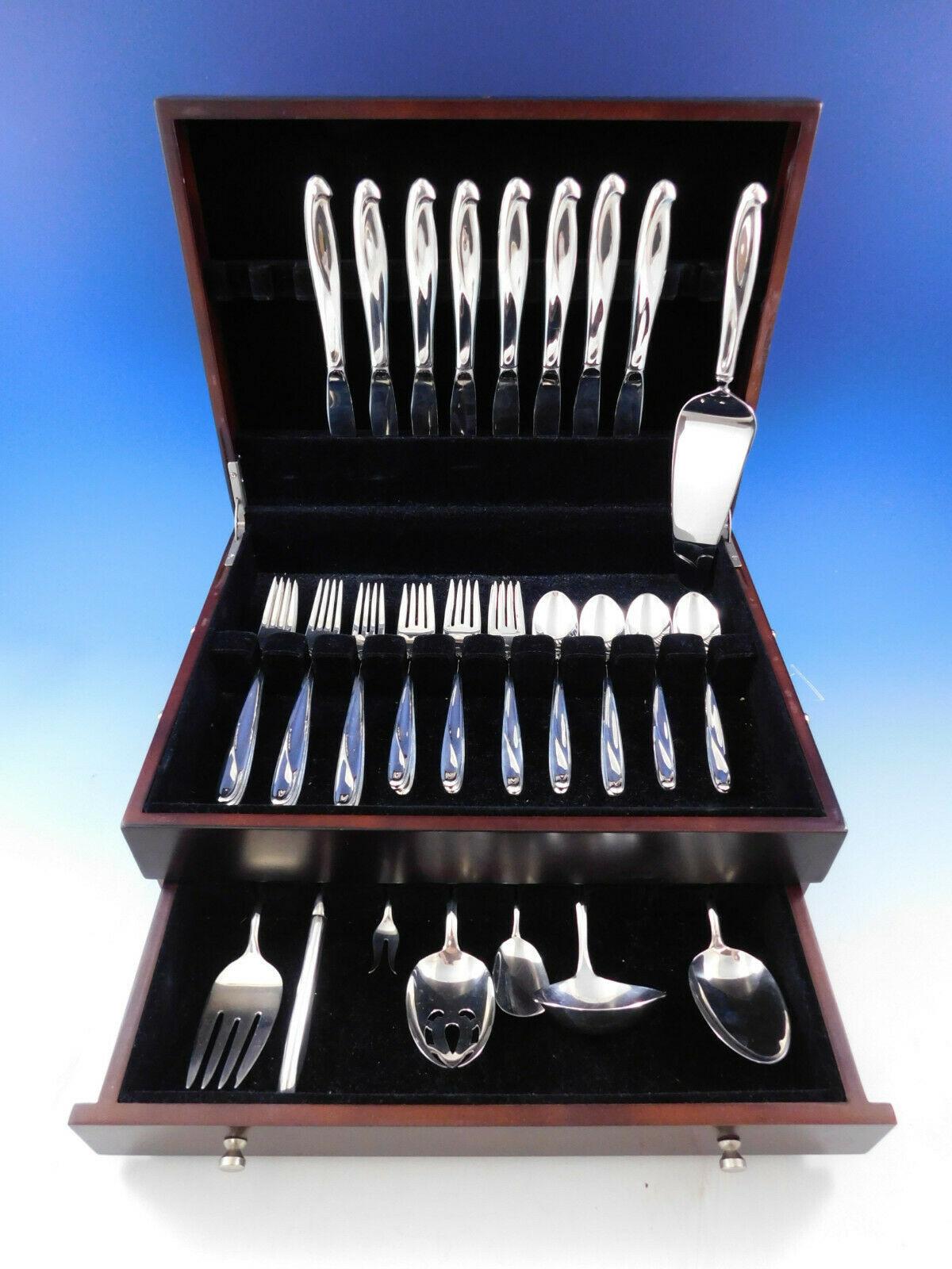 Silver Sculpture by Reed and Barton sterling silver Flatware set, 40 pieces. (See photo of Reed & Barton's 1954 advertisement, as illustrated in Modernism in American Silver by Stern book.) This set includes:

8 knives, 9