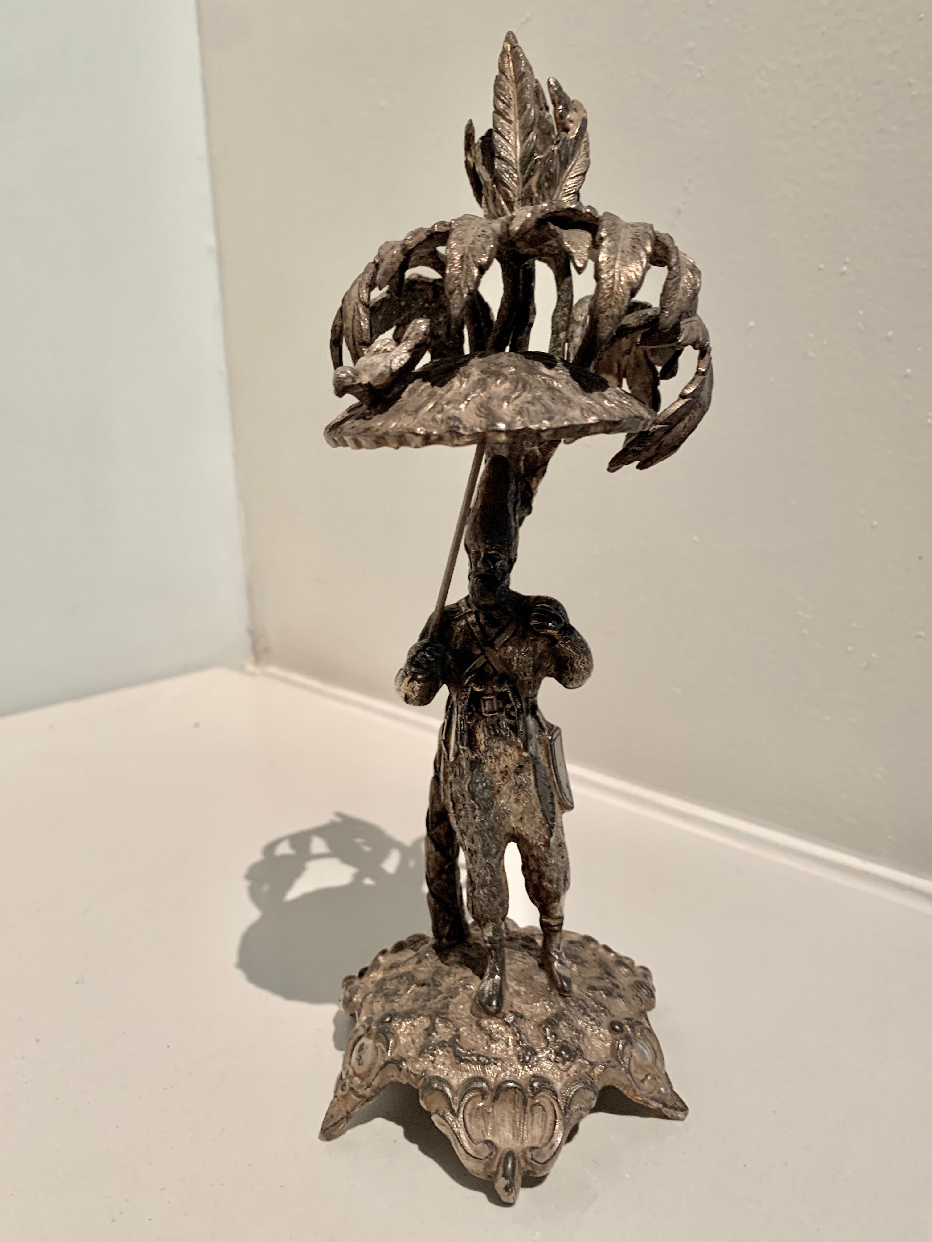 bird carrying man statue