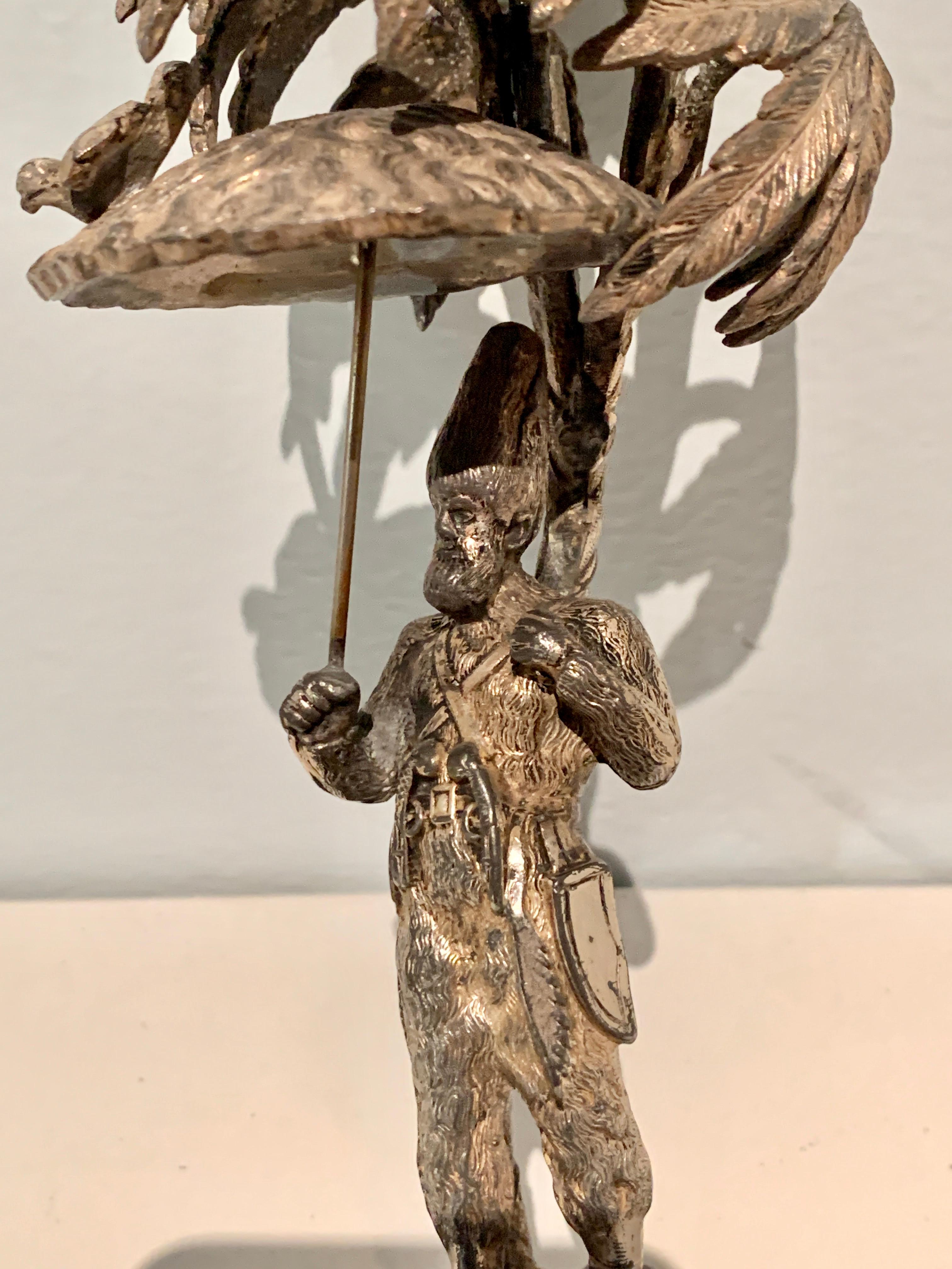 Silver Sculpture of a Man Holding Umbrella with Bird In Good Condition For Sale In Los Angeles, CA