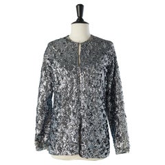 Silver sequin edge to edge evening jacket on a grey knit base Circa 1970's