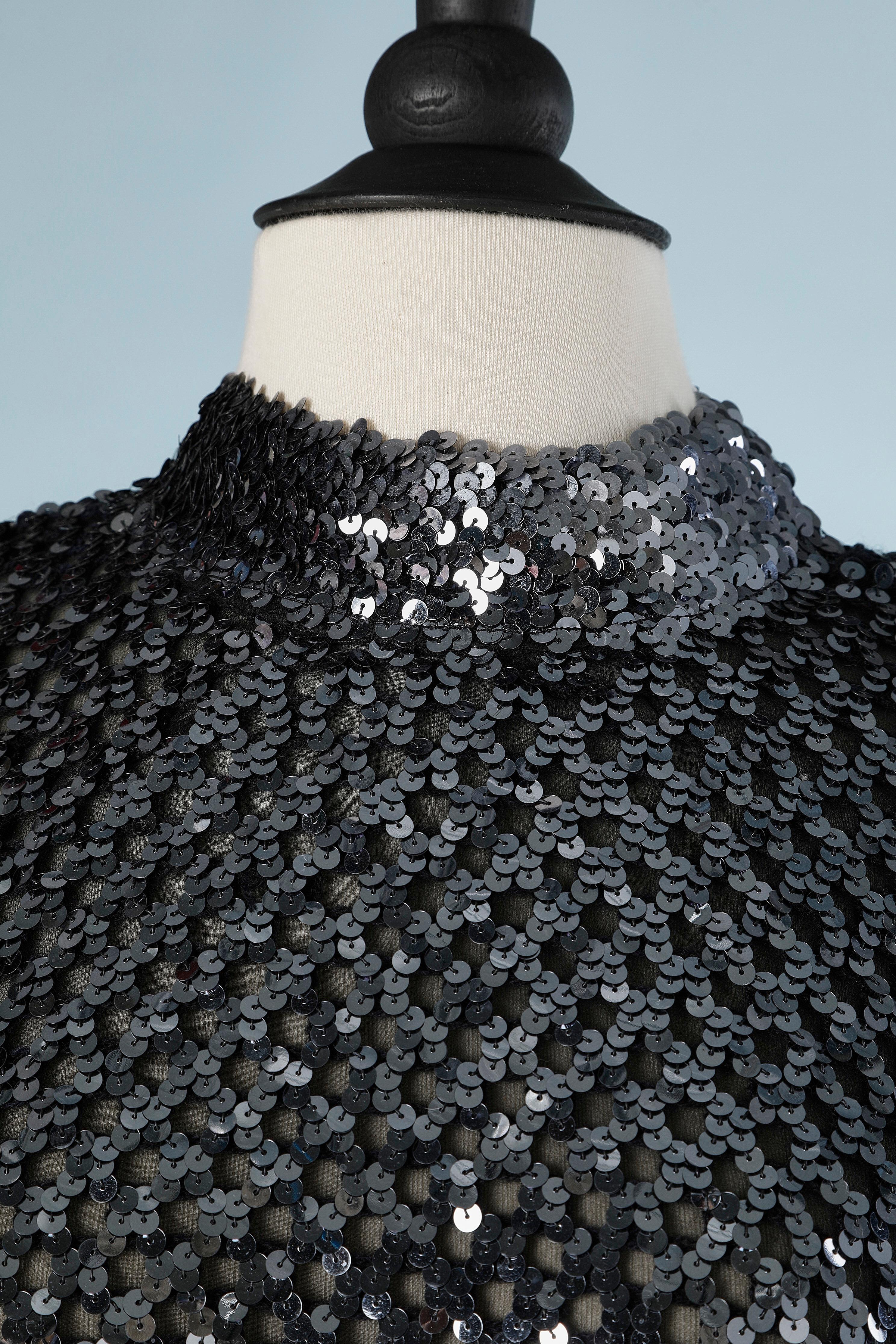 Silver sequin sweater on knit base and black chiffon lining.
Button on the middle back. 
SIZE M