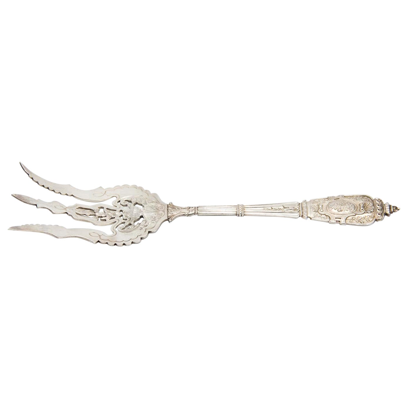 Silver serving fork in the shape of a trident with reliefs