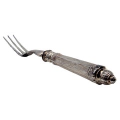 Antique Silver serving fork with three tines and guilloche on the hexagonal handle