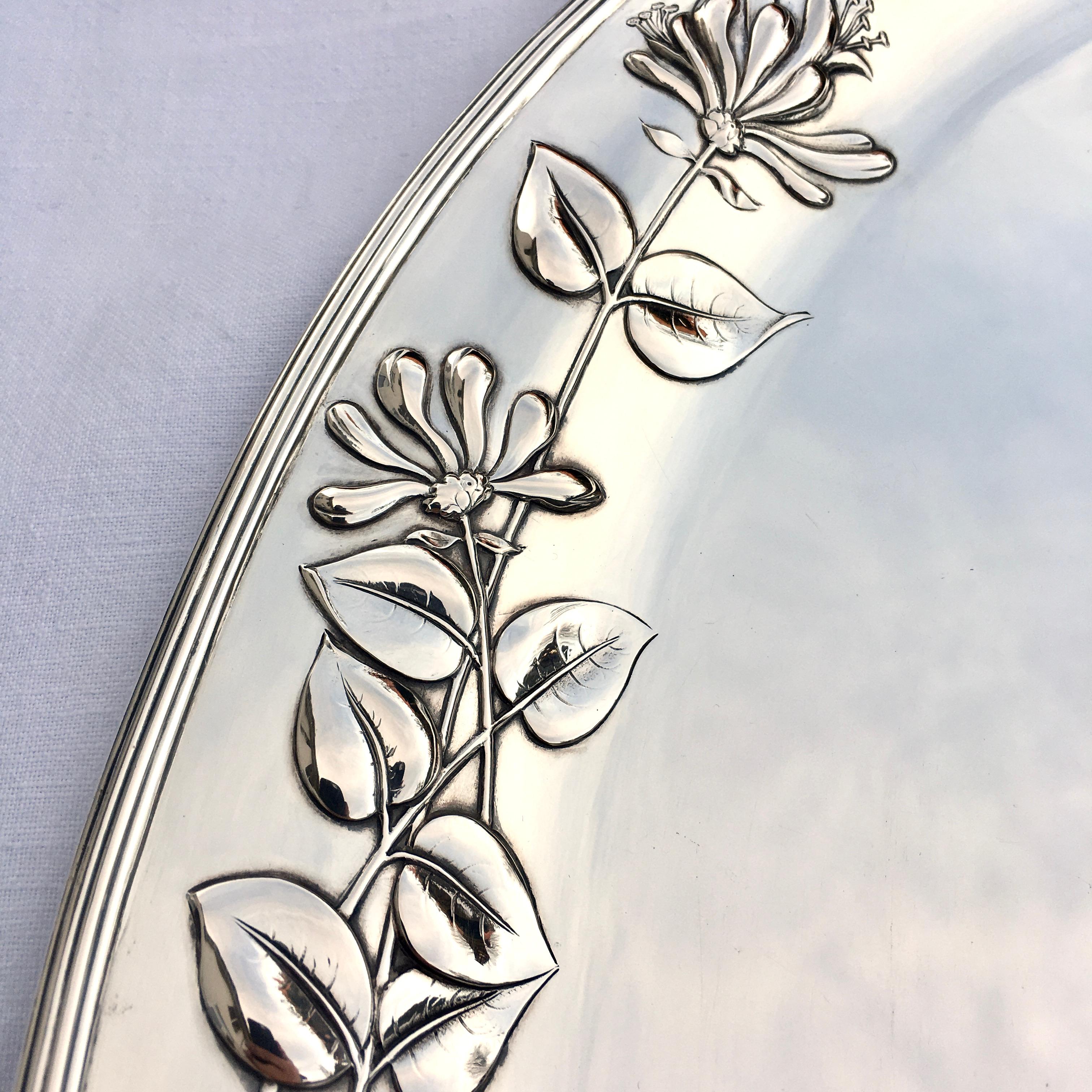 Silver serving platter, Art Nouveau, made by M.H. Wilkens & Söhne, Germany, 1899. Oval asymmetric shape combined with typical Art Nouveau floral decoration. This large unique and excellently made finest oblong silver serving platter of gorgeous