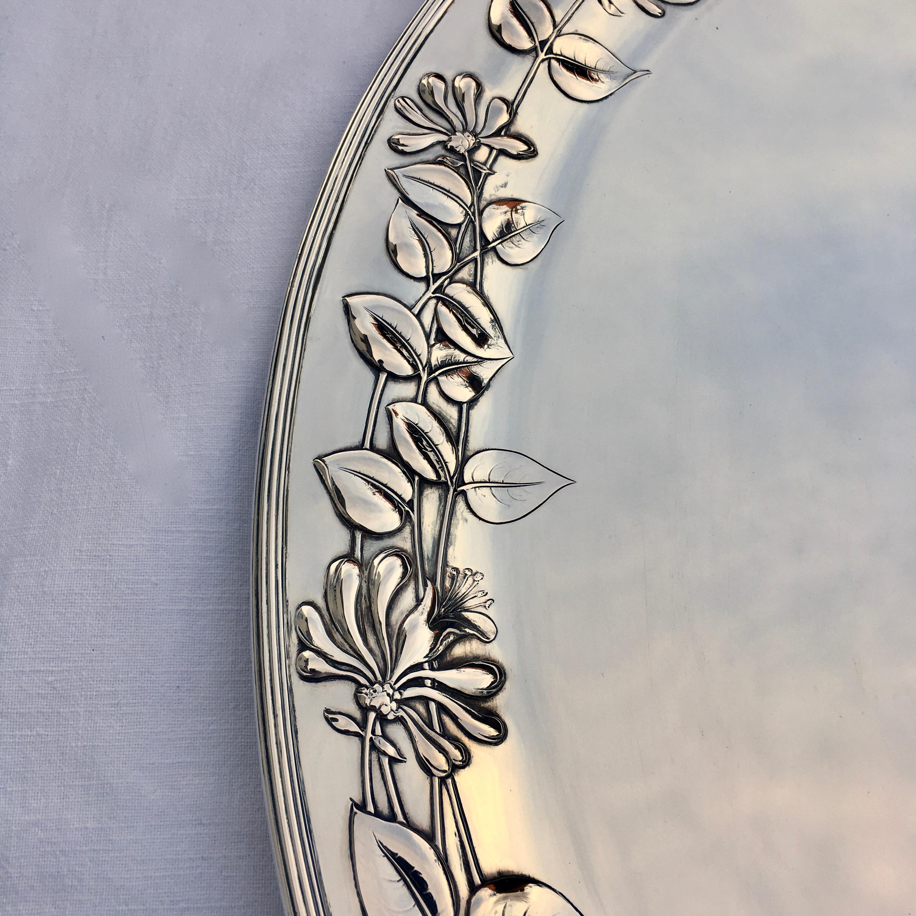 Silver Serving platter, Art Nouveau, made by M.H. Wilkens & Söhne. Oval asymmetric shape combined with typical Art Nouveau floral decoration. 

This large unique and excellently made finest oblong silver serving platter of gorgeous appearance. The
