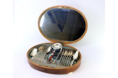 Silver set with strainer, tongs, twelve spoons and two shovels in case