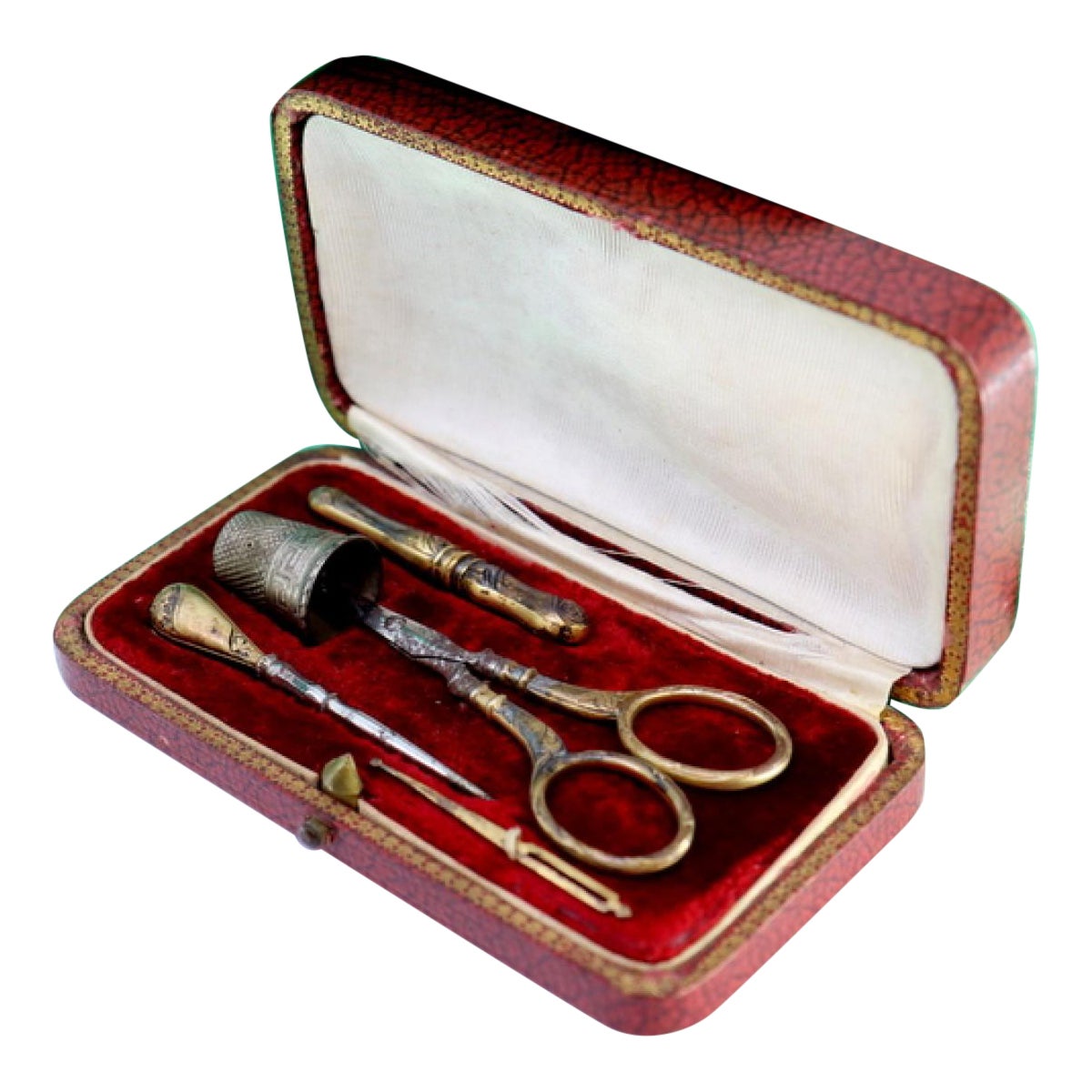 Silver sewing kit with various utensils in an original velvet case