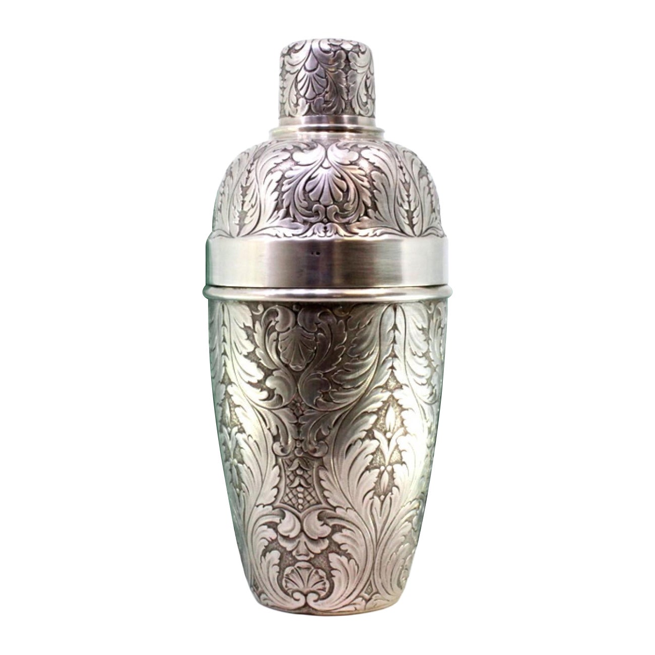 Silver shaker with revealed floral motifs and beading on the lid in vendita