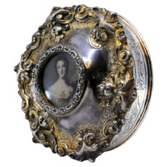 Silver shell-shaped jewelry box with antique lady card on removable lid