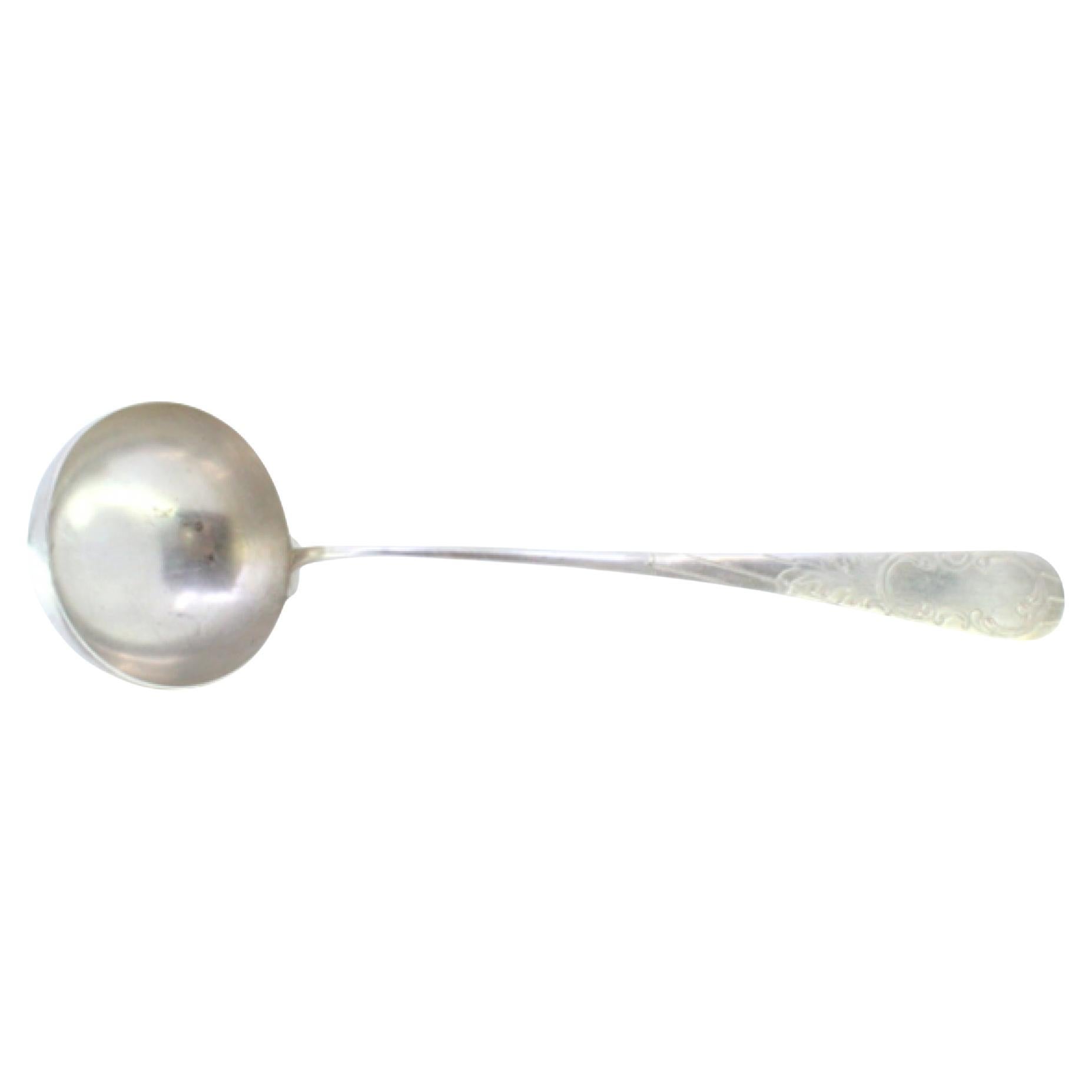 Silver shell-shaped ladle with engraved monogram cartouche For Sale
