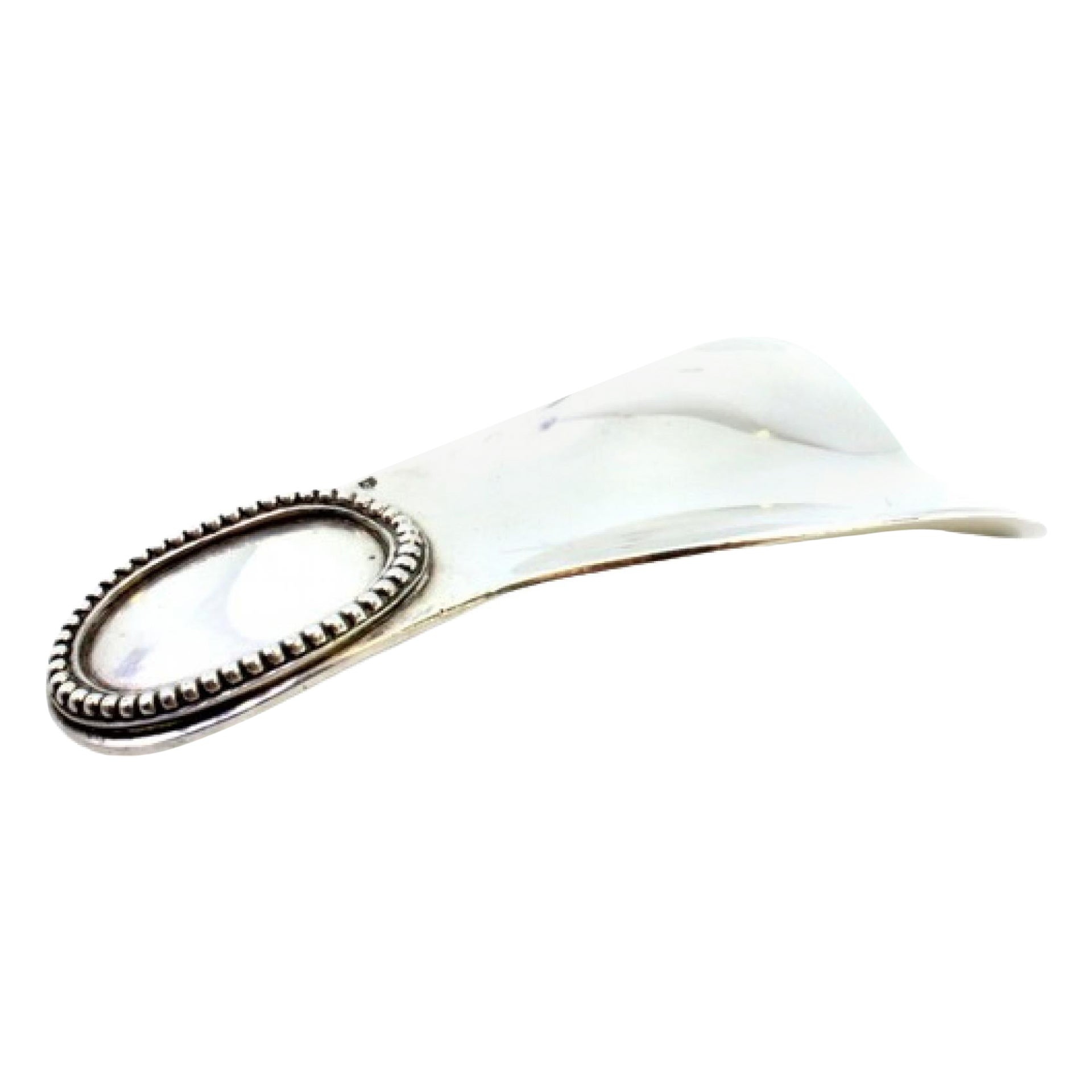 Silver shoehorn with pearl monogram plaque