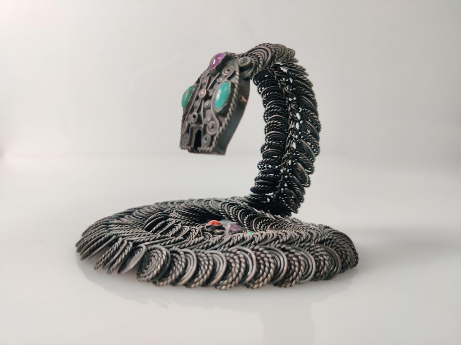 Fantastic snake necklace designed and stamped by Gustavo Martínez in silver with turquoise, amethyst and coral. Mexico, 1960s.