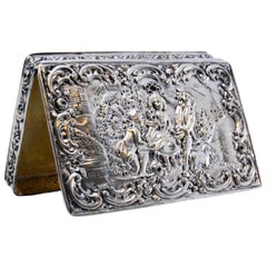 Silver snuff box w/ bucolic scene in relief on the hinged lid 
gilded interior