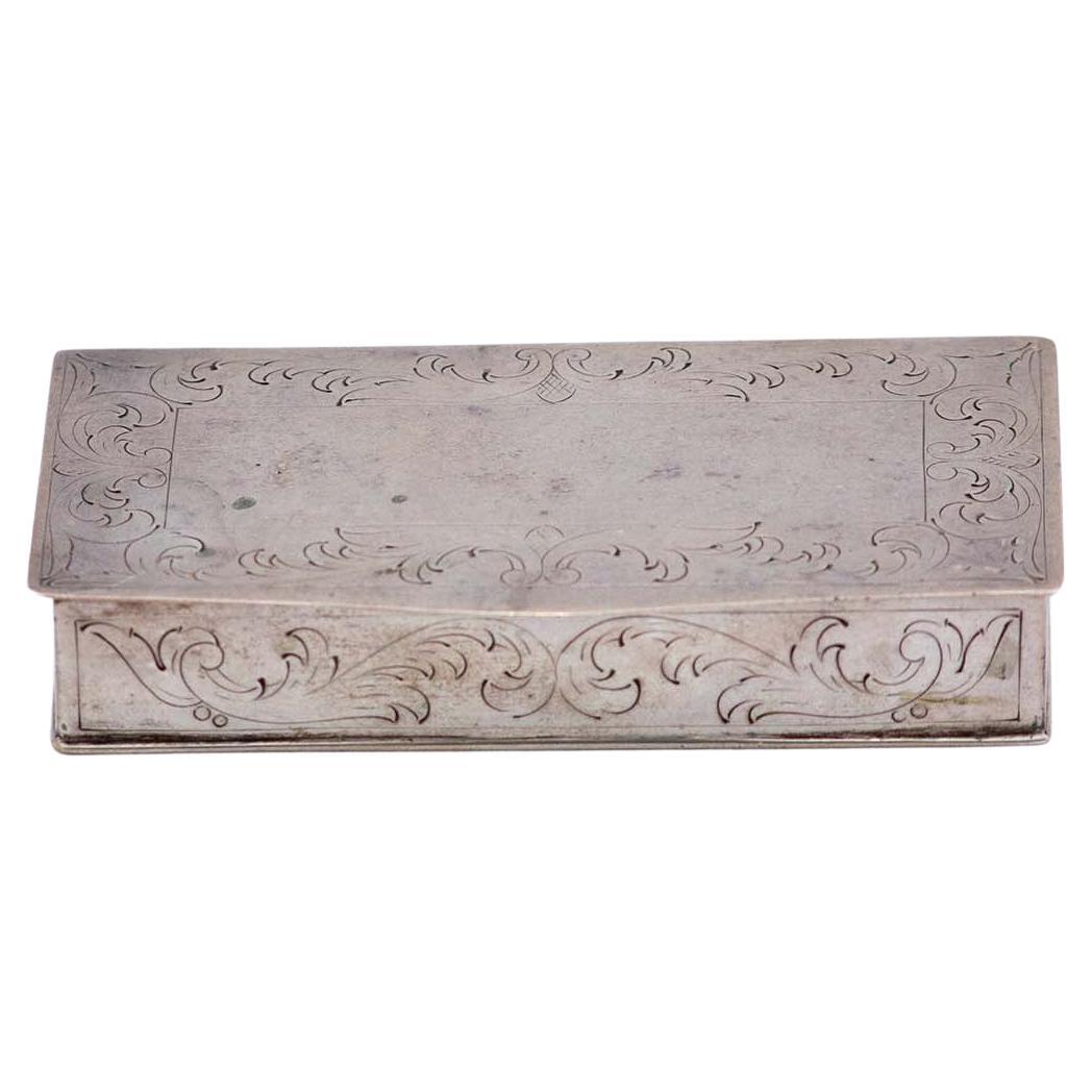 Silver snuff box w/ engravings surrounding the card, gold interior & hinged lid