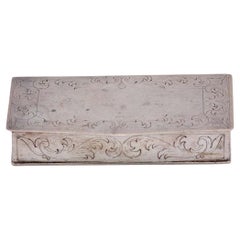 Silver snuff box w/ engravings surrounding the card, gold interior & hinged lid