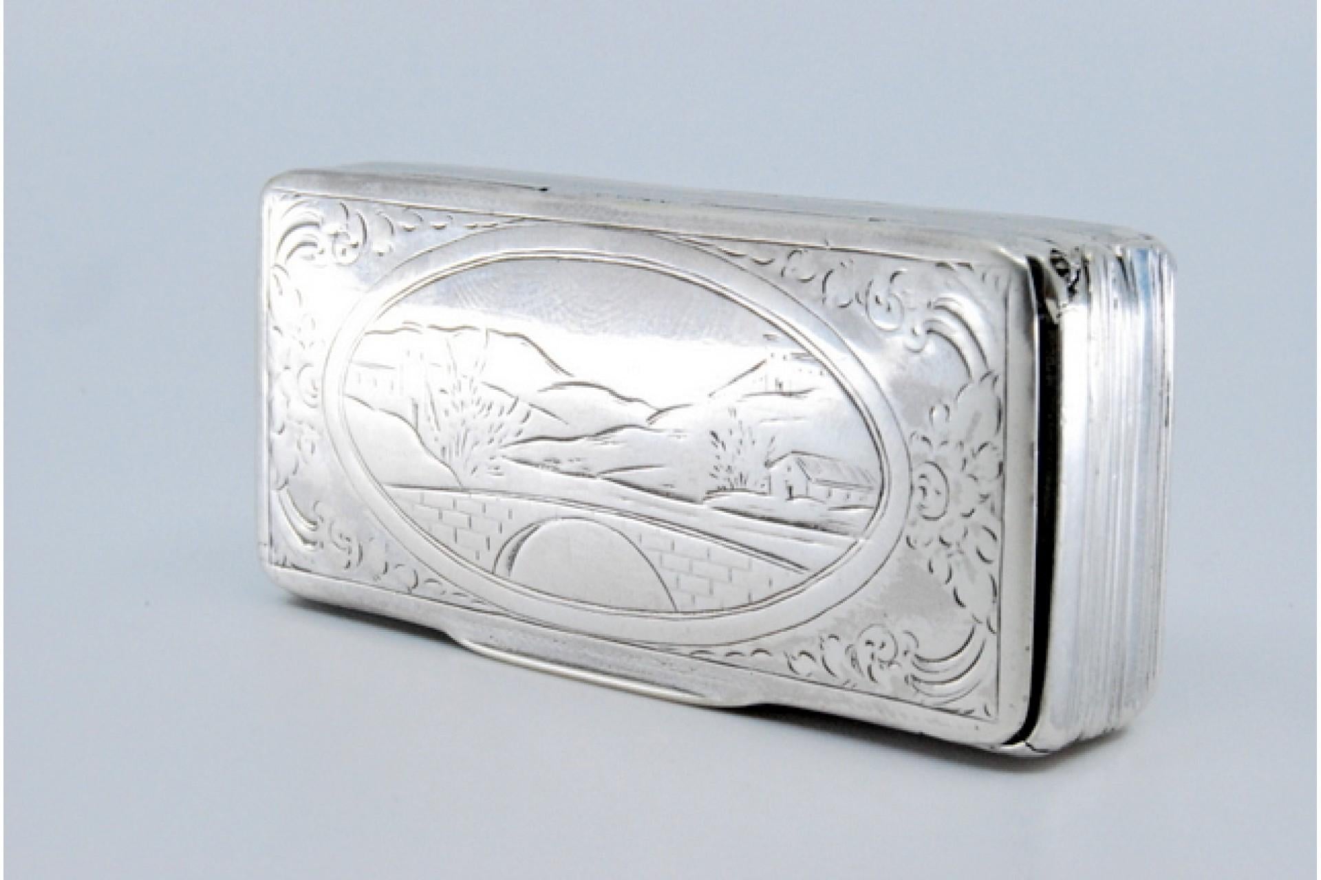 20th Century Silver snuff box w/ friezes around the edge, relief country motifs & hinged lid For Sale