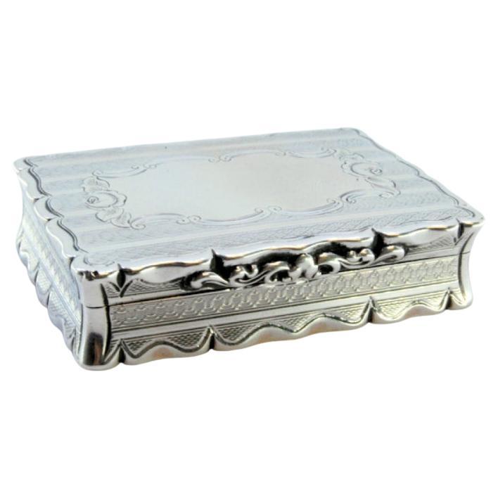 Silver snuff box w/ geometric figures 
floral motifs on the surrounding friezes For Sale