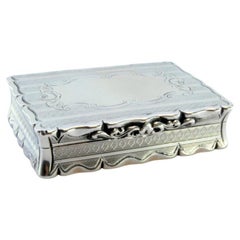 Silver snuff box w/ geometric figures 
floral motifs on the surrounding friezes