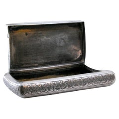 Silver snuff box with Arabic-style plant engravings & fluted base