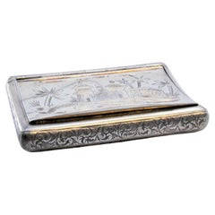 Silver snuff box with Arabic-style plant engravings 
fluted base