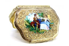 Silver snuff box with enamel couple scene in relief and gold interior