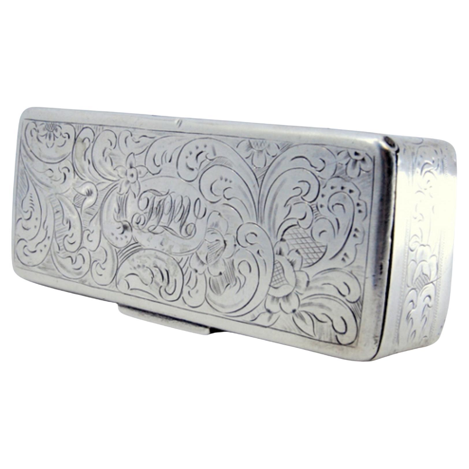 Description: Silver snuff box with engraved wreaths on the lid and casing. Metal: Silver. Origin: Portuguese. Brand: Lisbon Crown. Weight: 84.7 grams. Dimensions: 9x2.4cm. Content: 833/1000. Assay Mark: Yes, from the 15th century to 1885. Additional