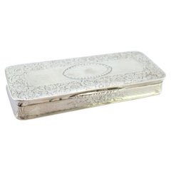 Silver snuff box with floral motifs around monogram and gold interior