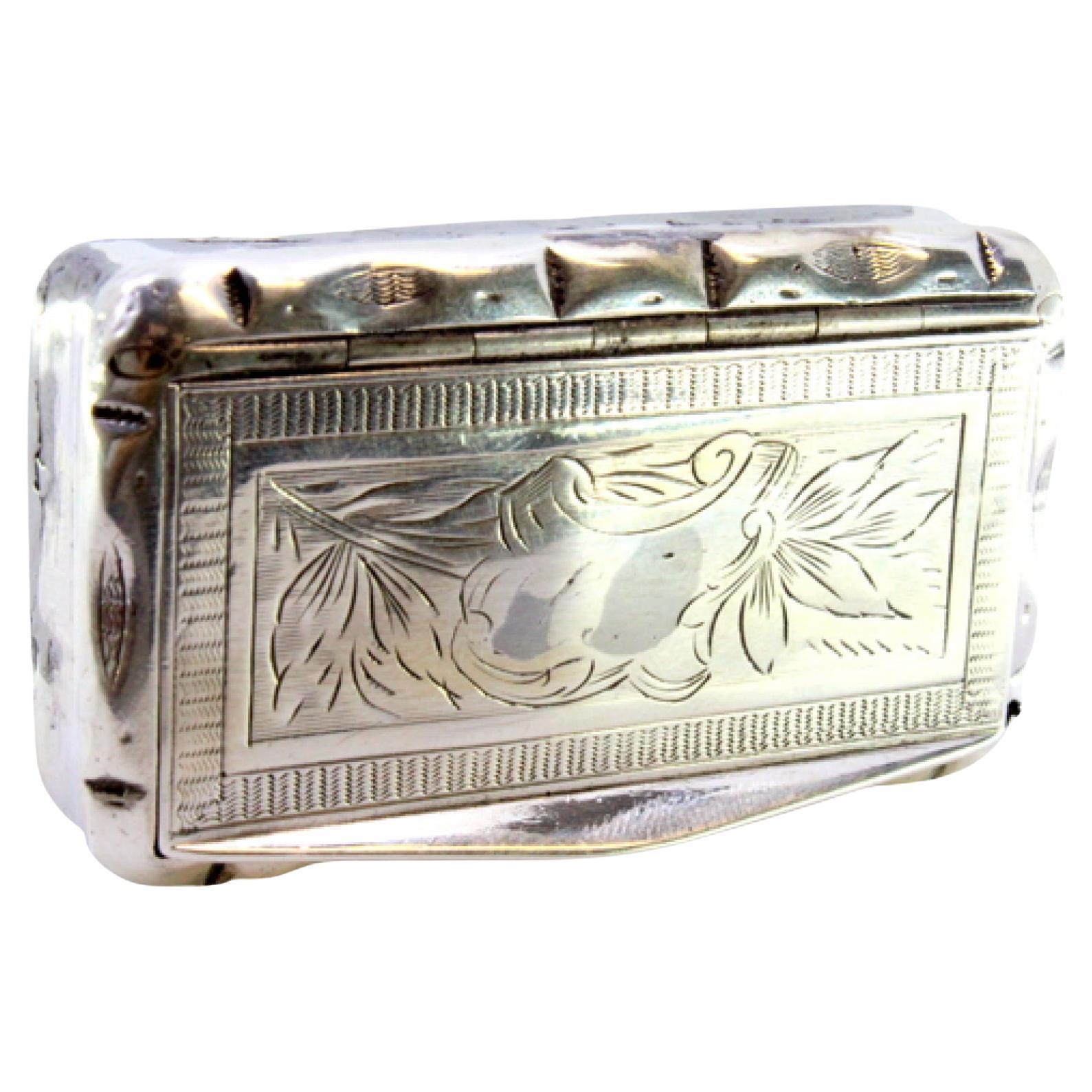 Description: Silver snuff box with floral motifs engraved on the hinged lid. Metal: Silver. Origin: French. Brand: Tête Minerve. Weight: 49.08 grams. Dimensions: 7cmx4cm. Content: 950/1000. Assay Mark: Yes, since 1838. Additional information: Signs