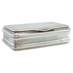 Silver snuff box with fluted reliefs along the length and a gold interior