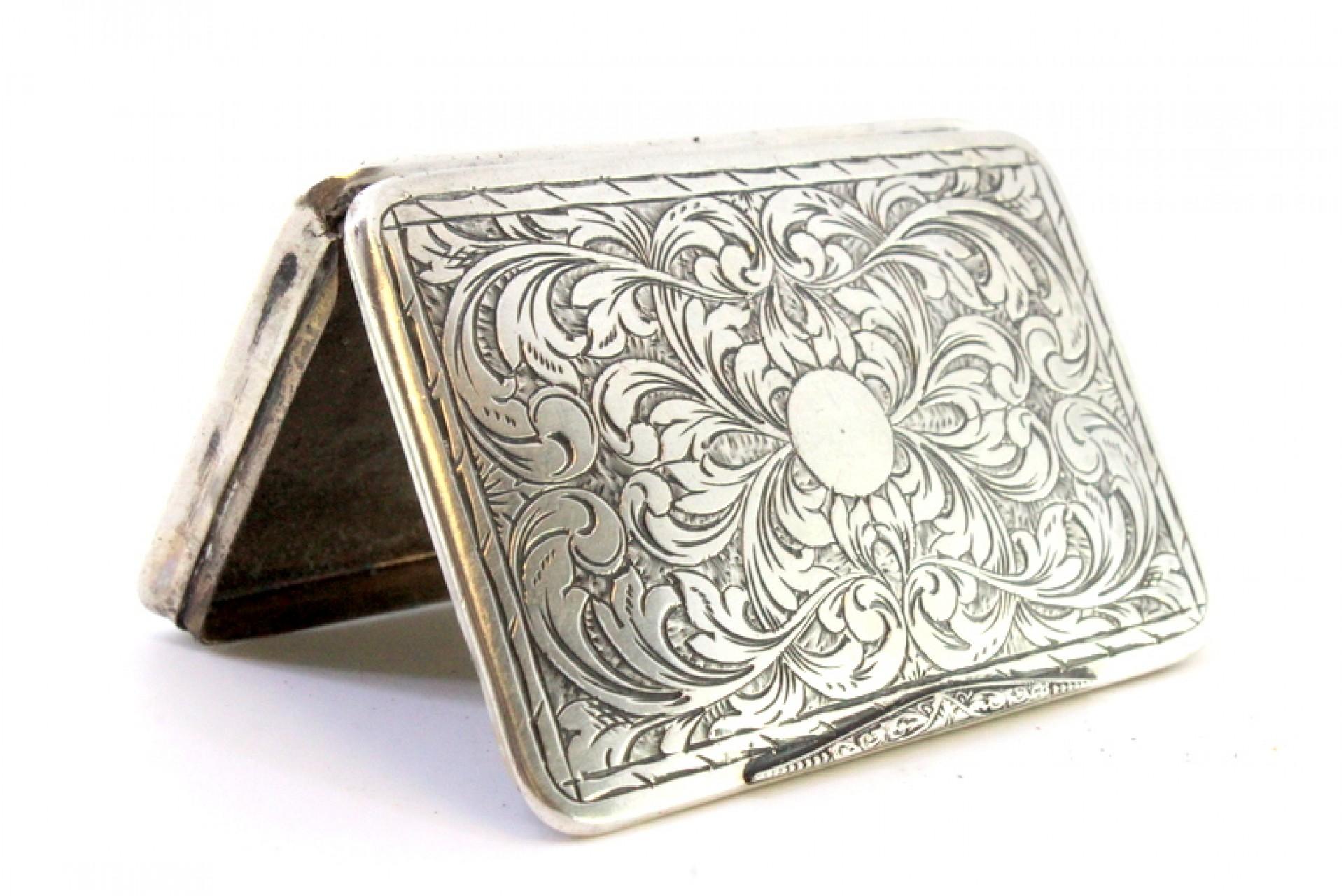 European Silver snuff box with raised floral motifs, monogram card and hinged lid For Sale