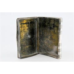 Silver snuff box with relief theater scene and hinged lid