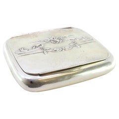 Silver snuffbox with relief lid 
interior paper holder